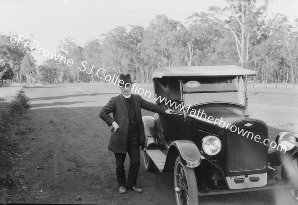 FR. COLMAN WITH CAR